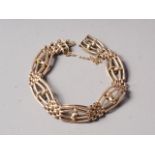 A 9ct gold gate bracelet, fitted safety chain, 13.8g