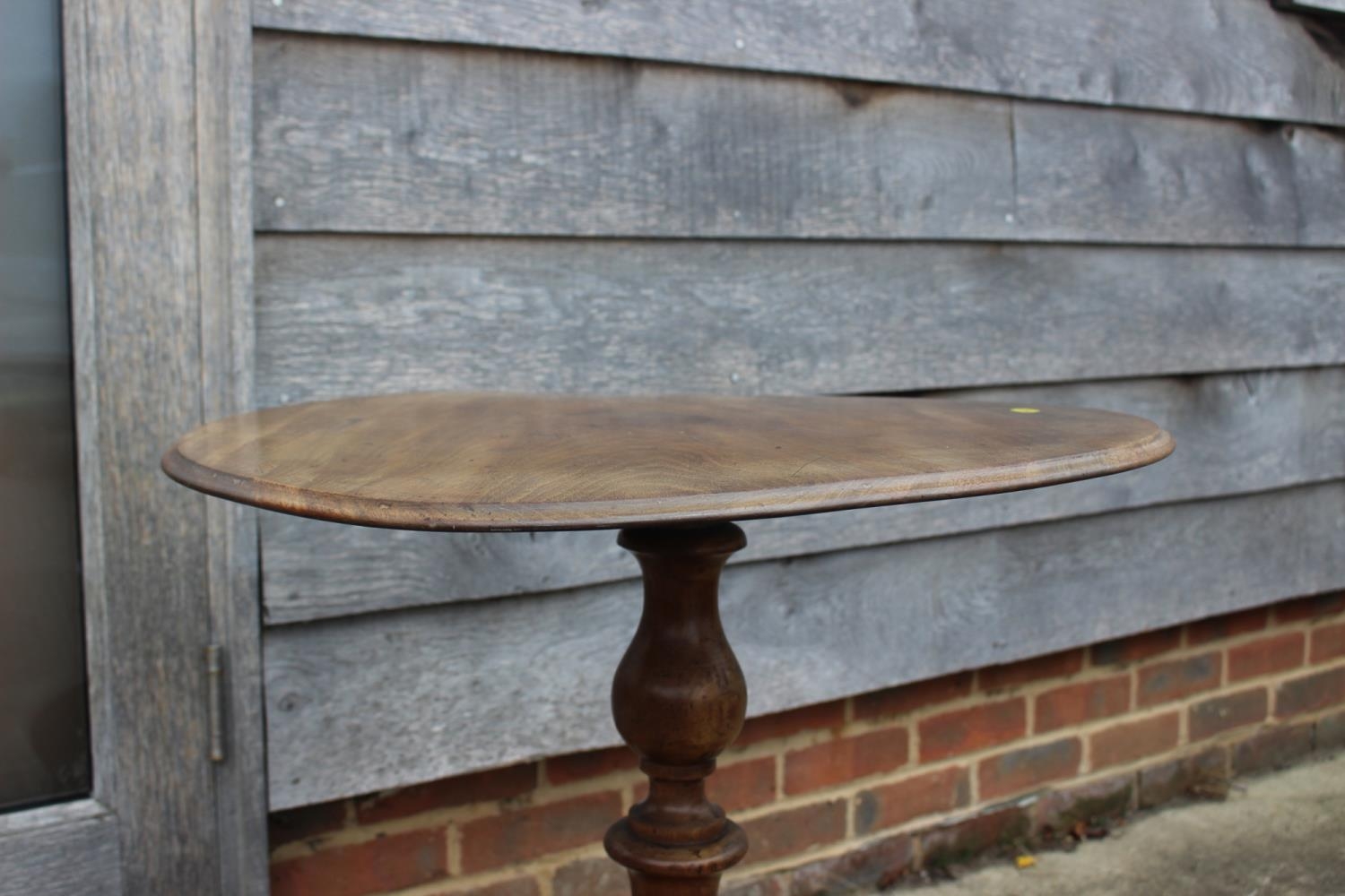 A 19th century walnut circular tilt top occasional table, on turned column and quadruple scroll - Image 2 of 2