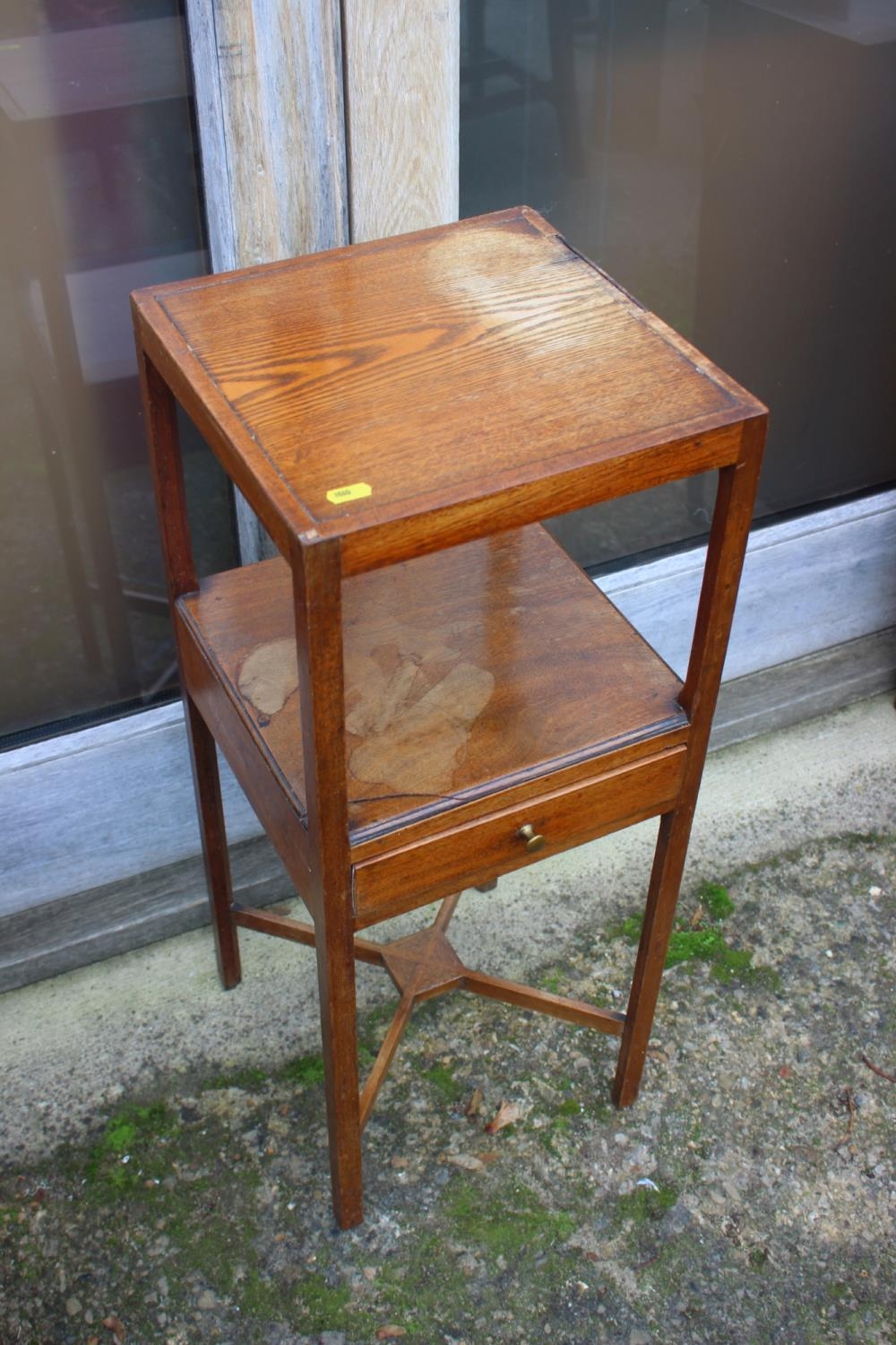 An early 20th century mahogany washstand, fitted one drawer, over undertier, 13" square x 28" high