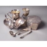 A silver plated octagonal Art Deco style biscuit box, a plated set of sugar tongs, a pair of