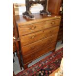An early 19th century mahogany and box line inlaid chest of two short and three long drawers with