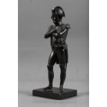 A 19th century bronze figure of the Emperor Napoleon, on rectangular base, 9" high