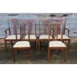 A set of six Edwardian mahogany and line inlaid splat back dining chairs with drop-in seats,