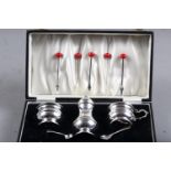 A silver three-piece cruet, in fitted case, and five silver cocktail sticks with "coral" bead