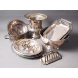 A silver plated campana ice bucket, two entree dishes and covers, a plated punchbowl and other plate