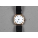 A 9ct gold cased wristwatch with white enamel dial, Roman numerals and subsidiary seconds dial at