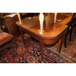 A 19th century mahogany and box line inlaid 'D' shape fold over top tea table, on square taper