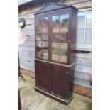 A 19th century mahogany display cabinet, the upper section enclosed two Gothic lattice glazed