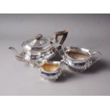 An early 20th century matched silver three-piece half-fluted teaset, 37.3oz troy approx