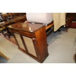 A 19th century rosewood chiffonier, fitted frieze drawer over two glazed doors, on block base, 41