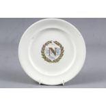 A Sarreguemines pottery plate with Napoleonic emblem decoration, 8" dia (rim chips)