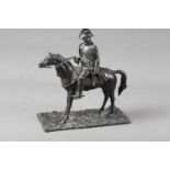A 19th century patinated bronze figure of the Emperor Napoleon on horseback, 10" high (scabbard
