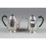 A Walker & Hall silver coffee pot with card cut decoration, ebonised handle and knop, and a