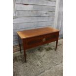 An Edwardian mahogany and banded side cupboard/carving table enclosed two doors, on square taper