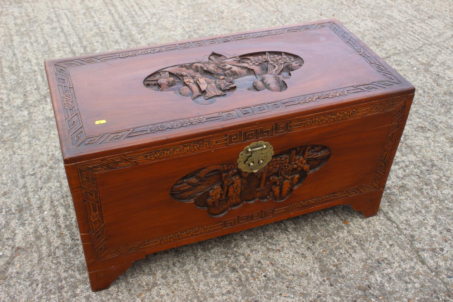 A Chinese carved camphor wood chest, on bracket feet, 37" wide x 17 1/2" deep x 20" high