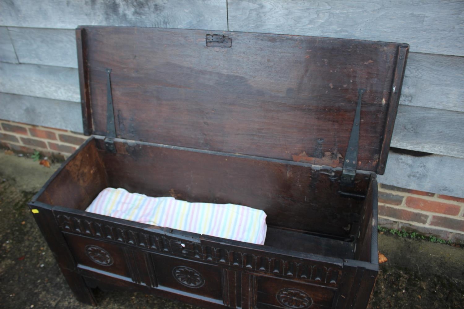 An early 18th century carved oak triple panel front coffer, on panel end supports, 43" wide x 16" - Image 5 of 5