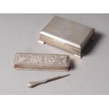 A silver cigarette box with engine turned decoration, 4 3/4" wide, and a silver rectangular dressing