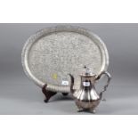 A Persian engraved white metal oval tray with all-over scroll design, 15" x 19", and a silver plated