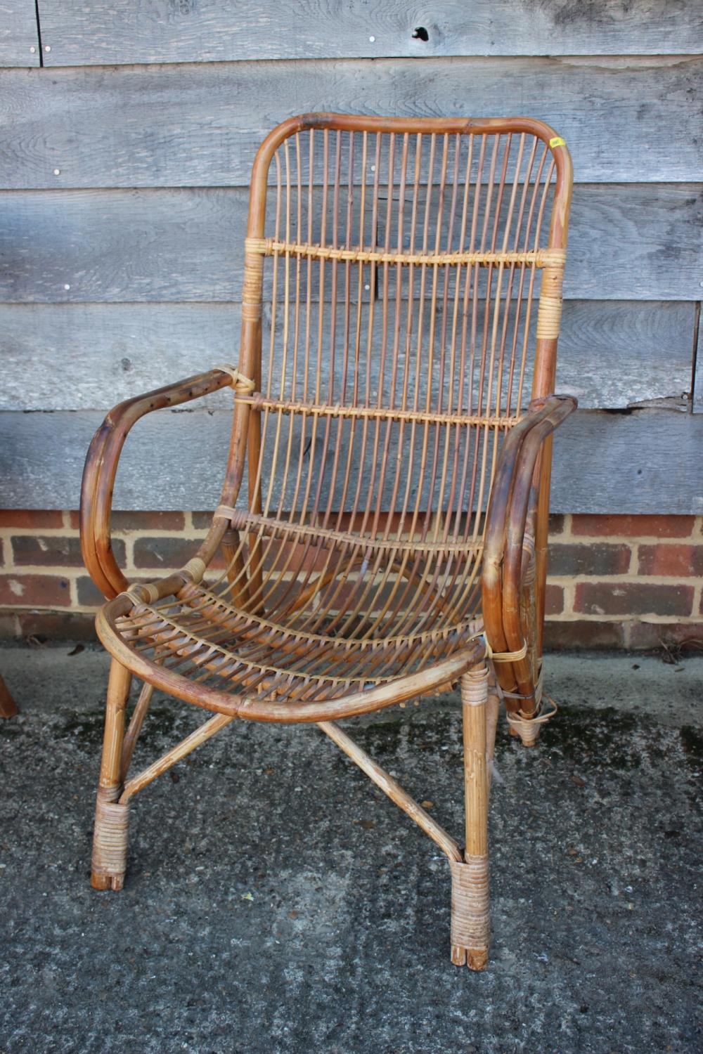 Two rattan elbow chairs, a walnut cane seat bedroom chair and a vertical rail side chair