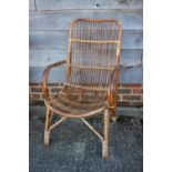 Two rattan elbow chairs, a walnut cane seat bedroom chair and a vertical rail side chair