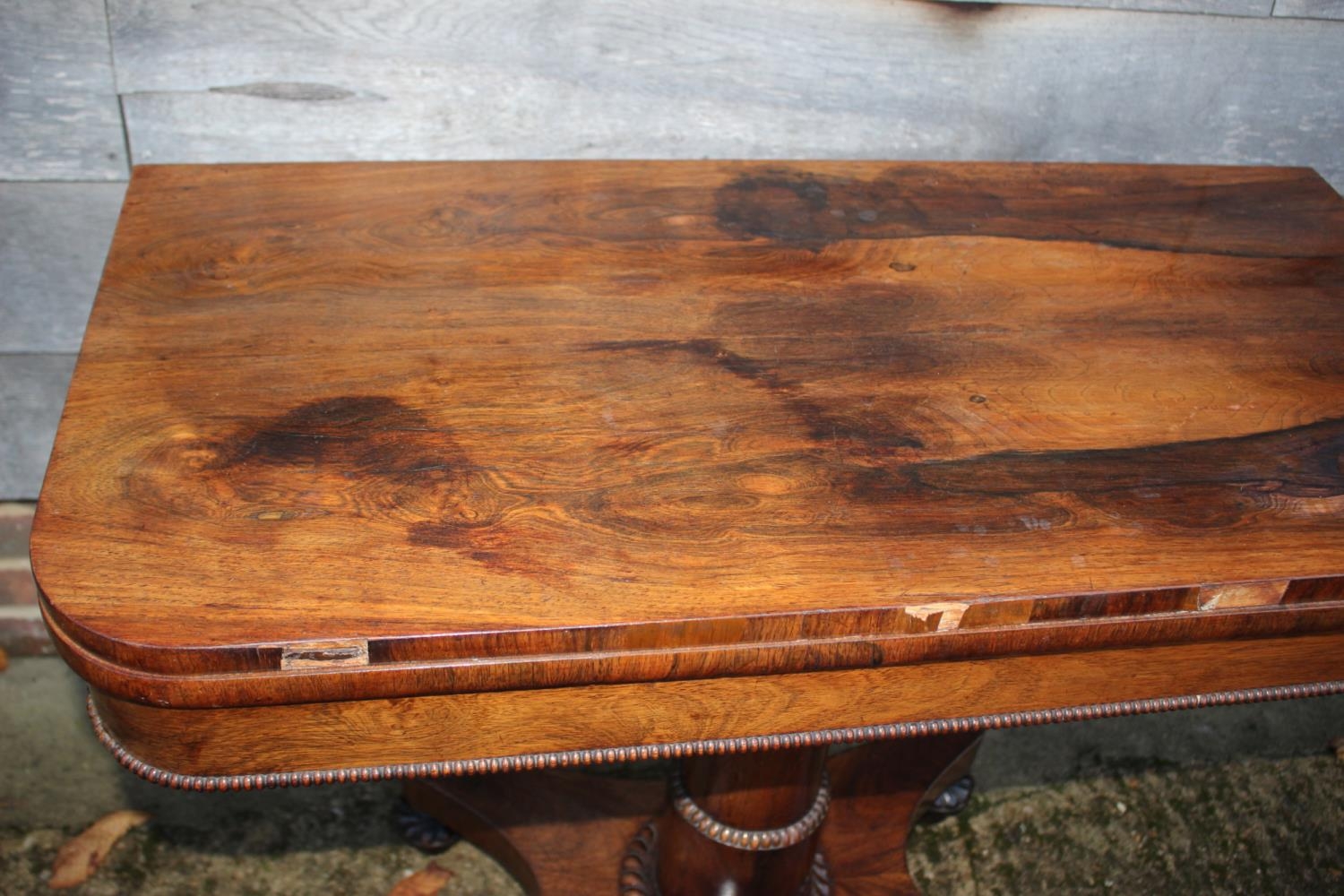 An early 19th century rosewood fold-over top card table, on pedestal and quatreform base, 36" wide - Image 2 of 4