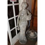 A cast stone figure of a water carrier, 51" high