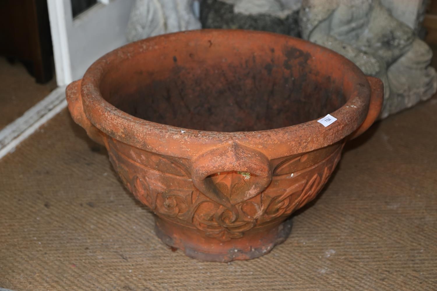 An Art Nouveau terracotta relief decorated planter, 26" dia