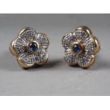 A pair of 9ct gold, diamond and sapphire flower head ear studs, 3.6g gross