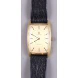 An Omega De Vile rectangular faced wristwatch with gold dial and baton numerals