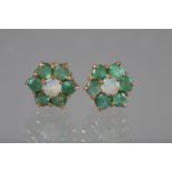 A pair of yellow metal emerald and opal ear studs