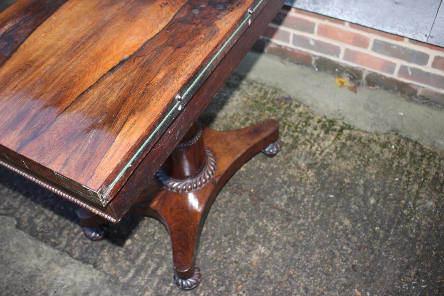 An early 19th century rosewood fold-over top card table, on pedestal and quatreform base, 36" wide - Image 4 of 4