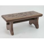 A delightful folding stool having twin solid hinged legs with locking drop down spindle,