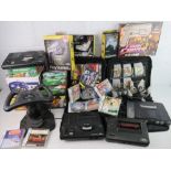 A large collection of video game consoles including two Sega Mega Drive, Playstation, Xbox,