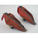 Lotus Feet Shoes; a pair of 19th century Chinese embroidered silk foot binding shoes,