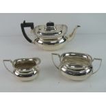 A HM silver tea service bearing presentation inscription in Welsh that translates to Gifted by