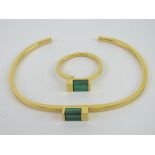 A suite of malachite jewellery comprising bangle and ring of geometric design, ring size adjustable.