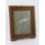 Unusual Folk Art Tramp Art frame - a five tiered polychromed and brass stud decorated portrait