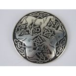 A St. Justin pewter brooch having three horses and Celtic knot design upon, 5.2cm dia.