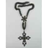 A 19th century Berlin Iron necklace bearing Gothic arched cross with profile over,