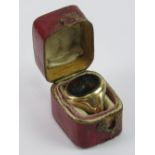 A 15ct gold signet ring having oval bloodstone bearing coat of arms featuring a Horses head out of