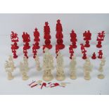 A 19th century Cantonese carved and red stained ivory chess set; one half red stained,