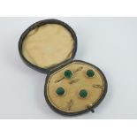 A delightful green enamelled brooch and three button set within original fitted box,