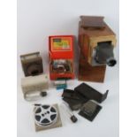 A vintage Bender 2.8:85mm cine projector within fitted stained wooden case.