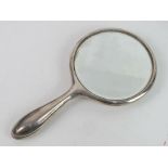 A HM silver dressing table hand mirror, hallmarked for Birmingham.