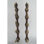 A pair of oak and muntjack antler hanging racks, each measuring 75cm in length.