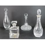 Two Edinburgh crystal decanters together with an 'Atlantis' square shaped decanter and another