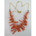 An antique coral branch necklace remounted on modern 9ct gold chain (extra chain included).