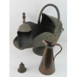 A copper coal scuttle with shovel, together with a copper jug and a metal bell.