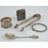 A quantity of assorted silver and white metal items; vesta case, napkin ring, bangle,