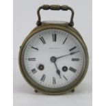 A good eight day striking enamel dial brass 'porthole' clock with swing handle,
